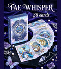 Fae Whisper Lenormand box with cards fanned beside it — Woman Ring Sun cards visible, amethyst crystals and pendulum, fairy oracle deck